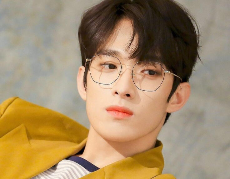 dokyeom with hexagonal glasses.